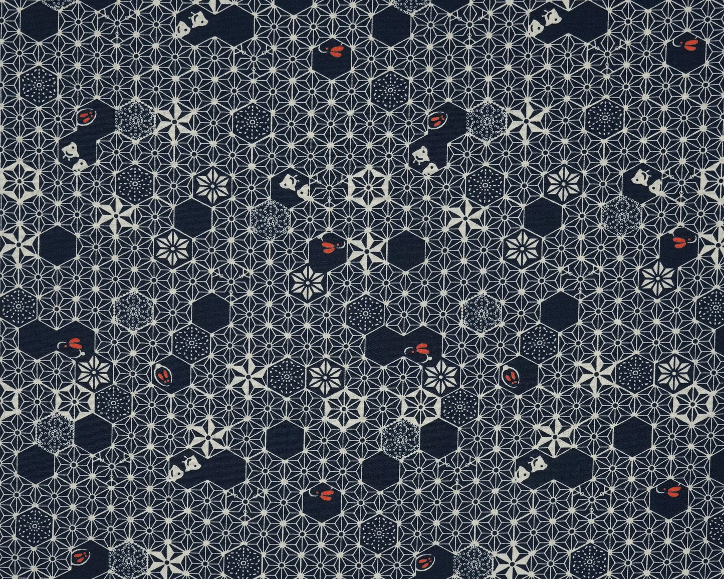 Patterned fabric with geometric shapes on a blue background