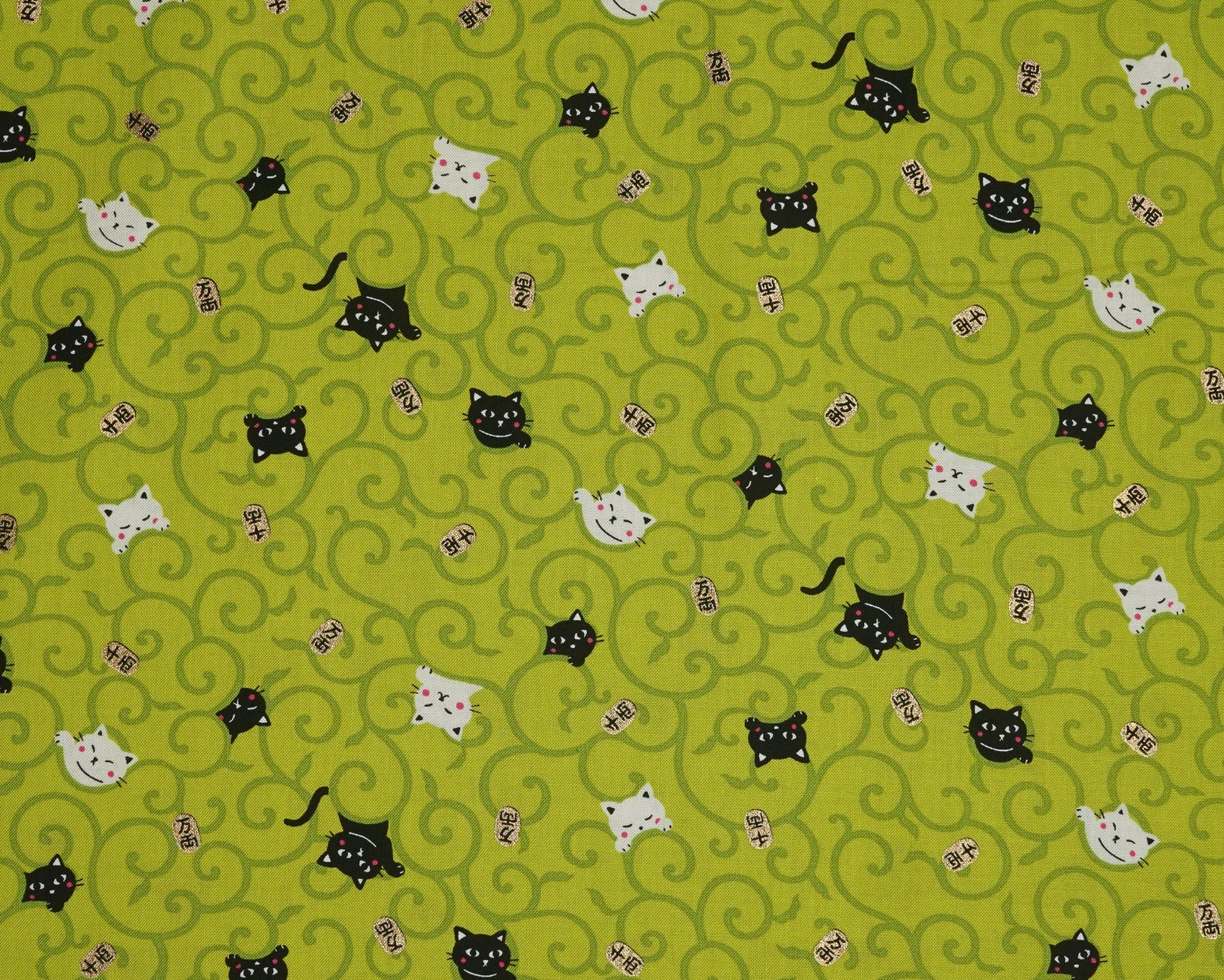 Pattern of black and white cats on a green background