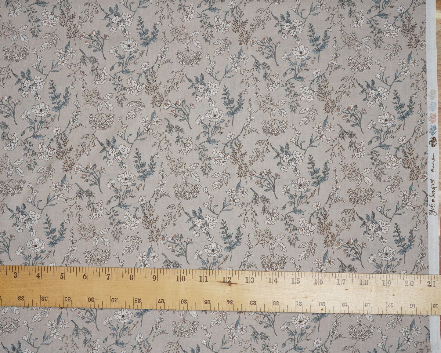 Floral patterned fabric with a measuring tape at the top
