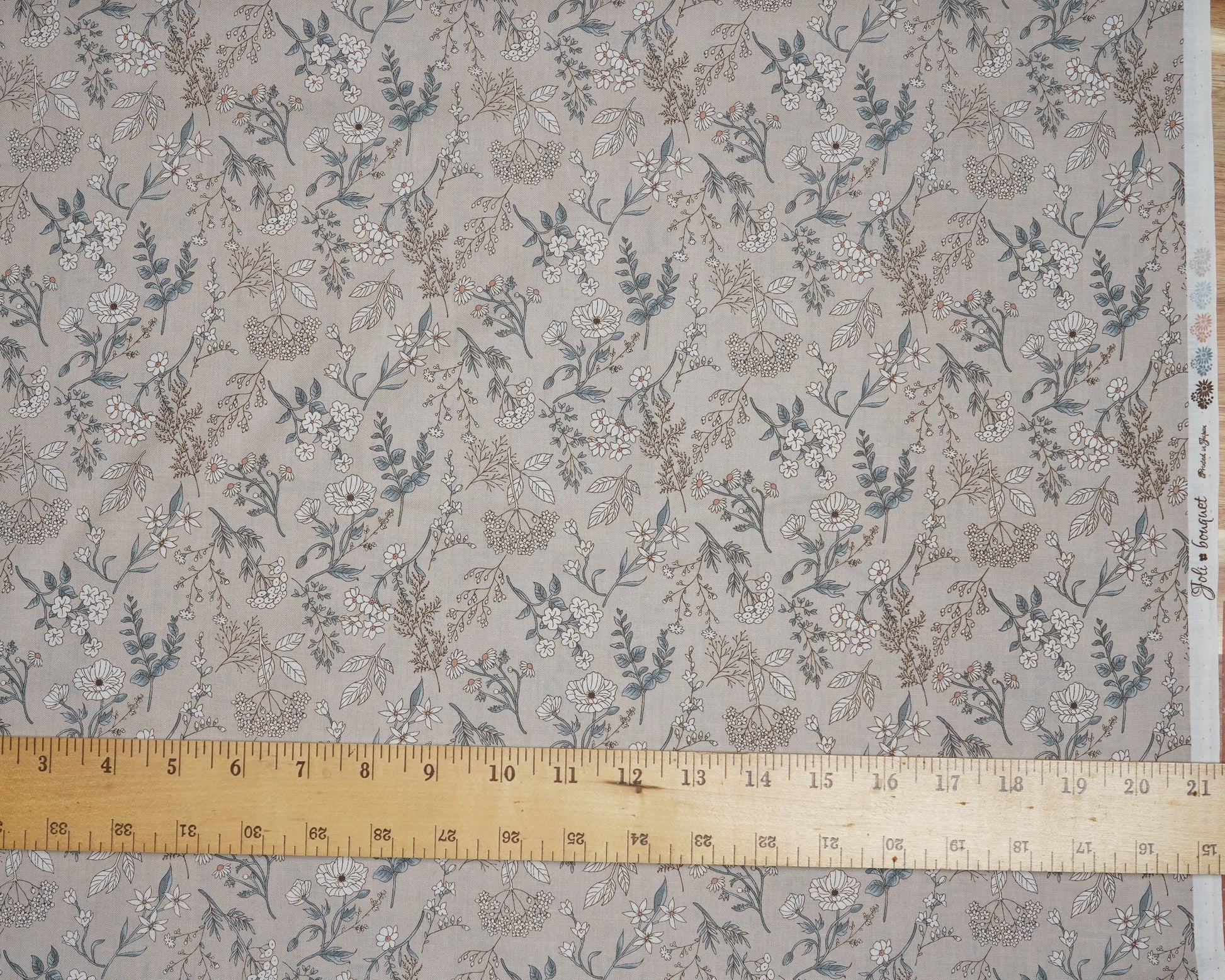 Floral patterned fabric with a measuring tape at the top