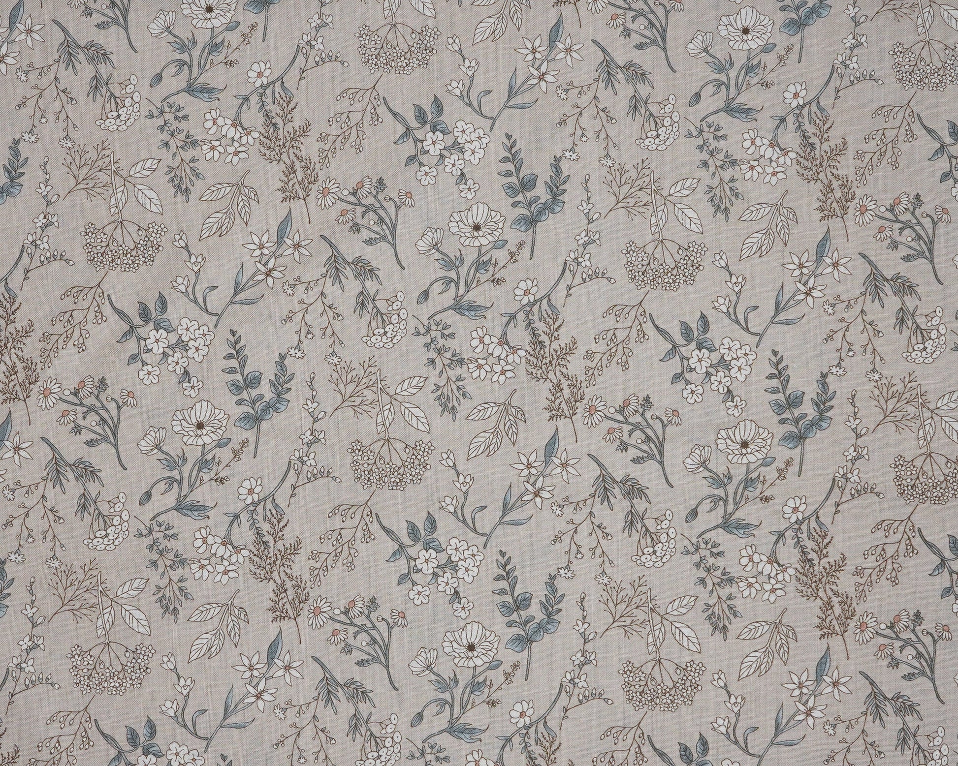 Floral patterned fabric with small flowers and leaves on a neutral background