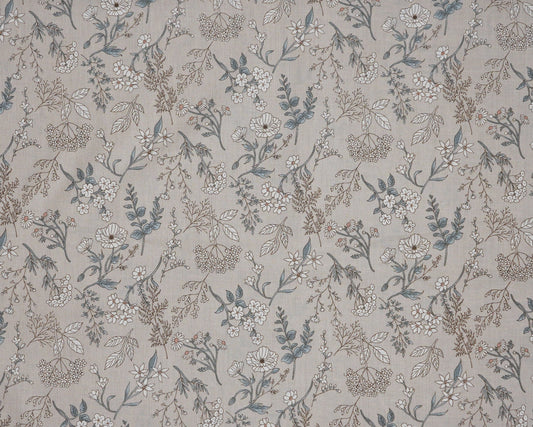Floral patterned fabric with small flowers and leaves on a neutral background