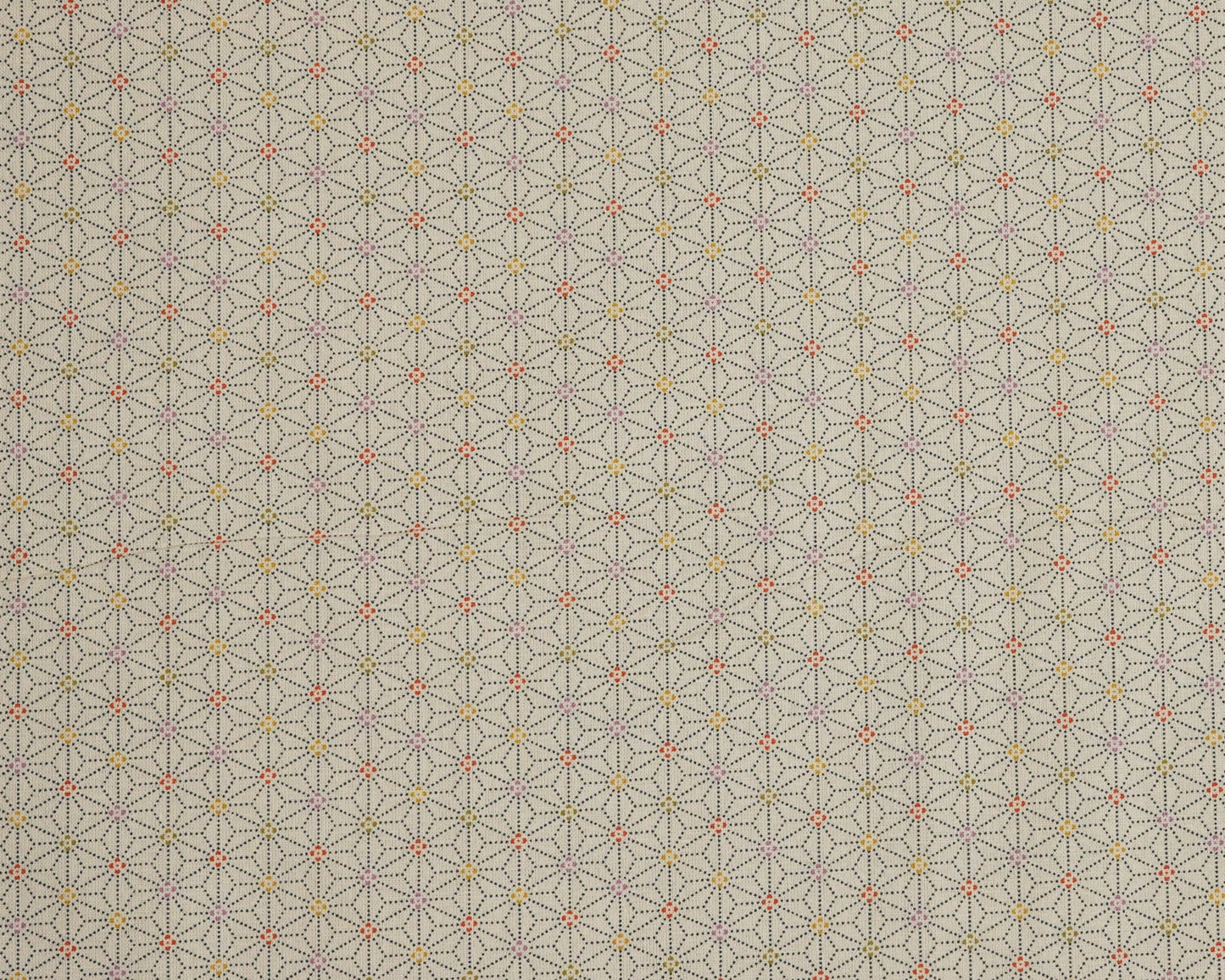 Patterned fabric with geometric design on a beige background