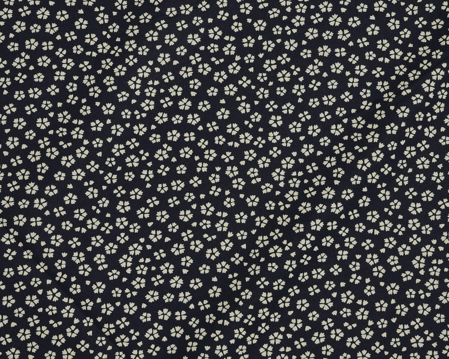 Small white floral pattern on a dark navy background