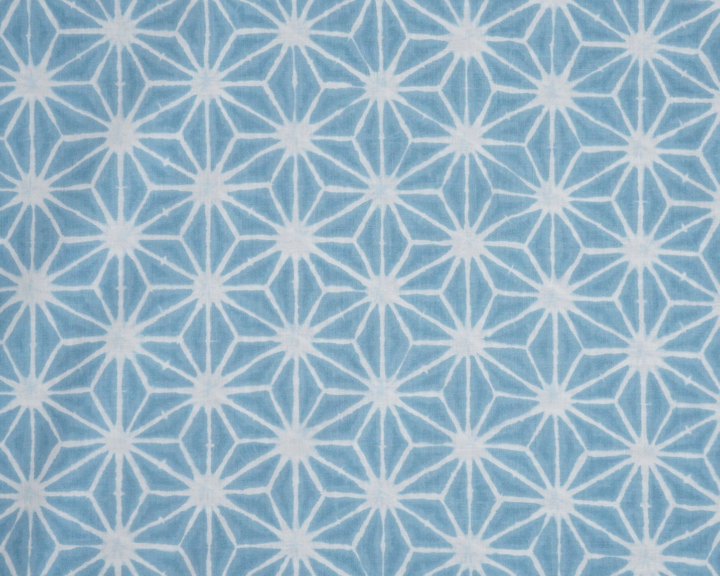 Blue fabric with white geometric pattern