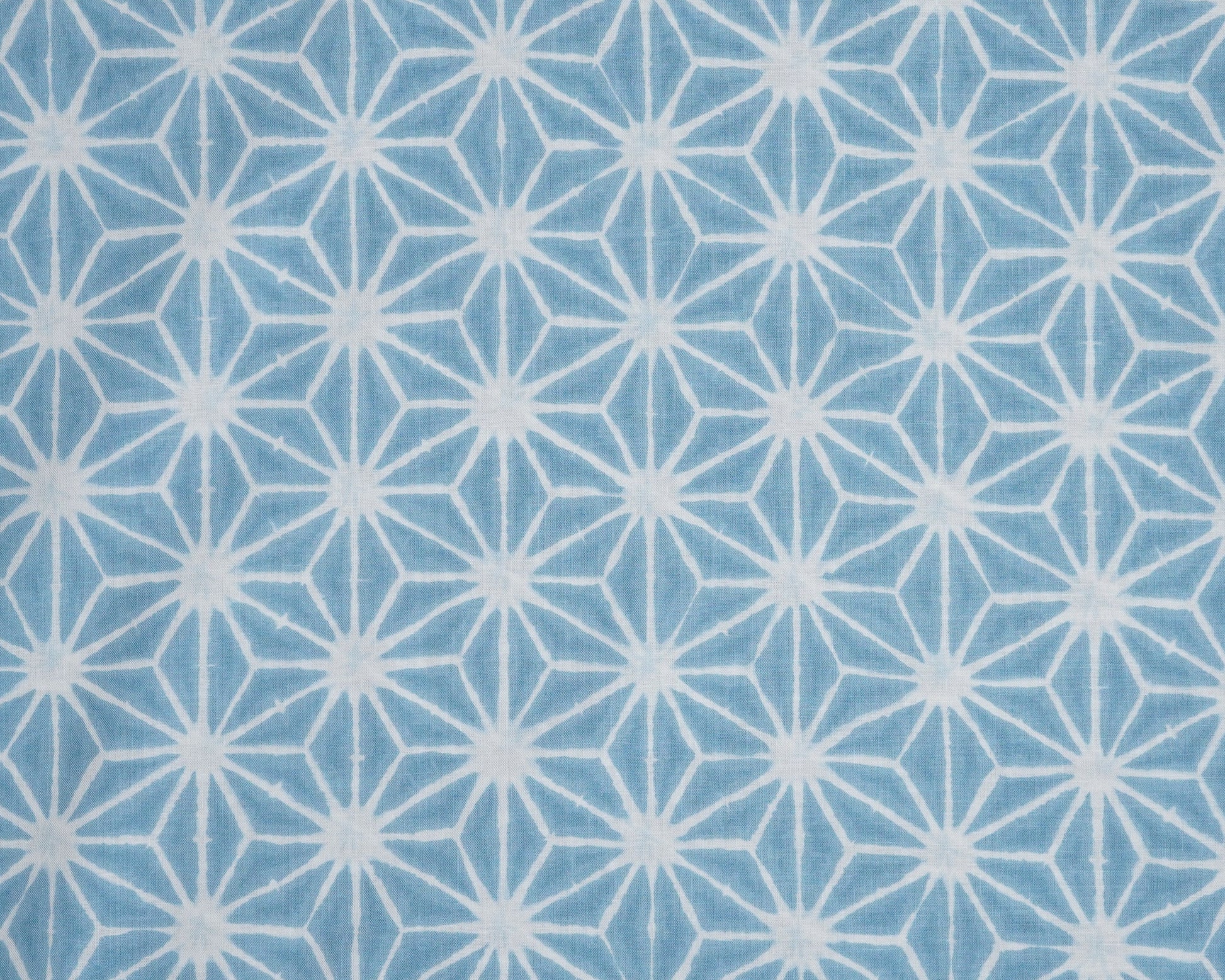Blue fabric with white geometric pattern