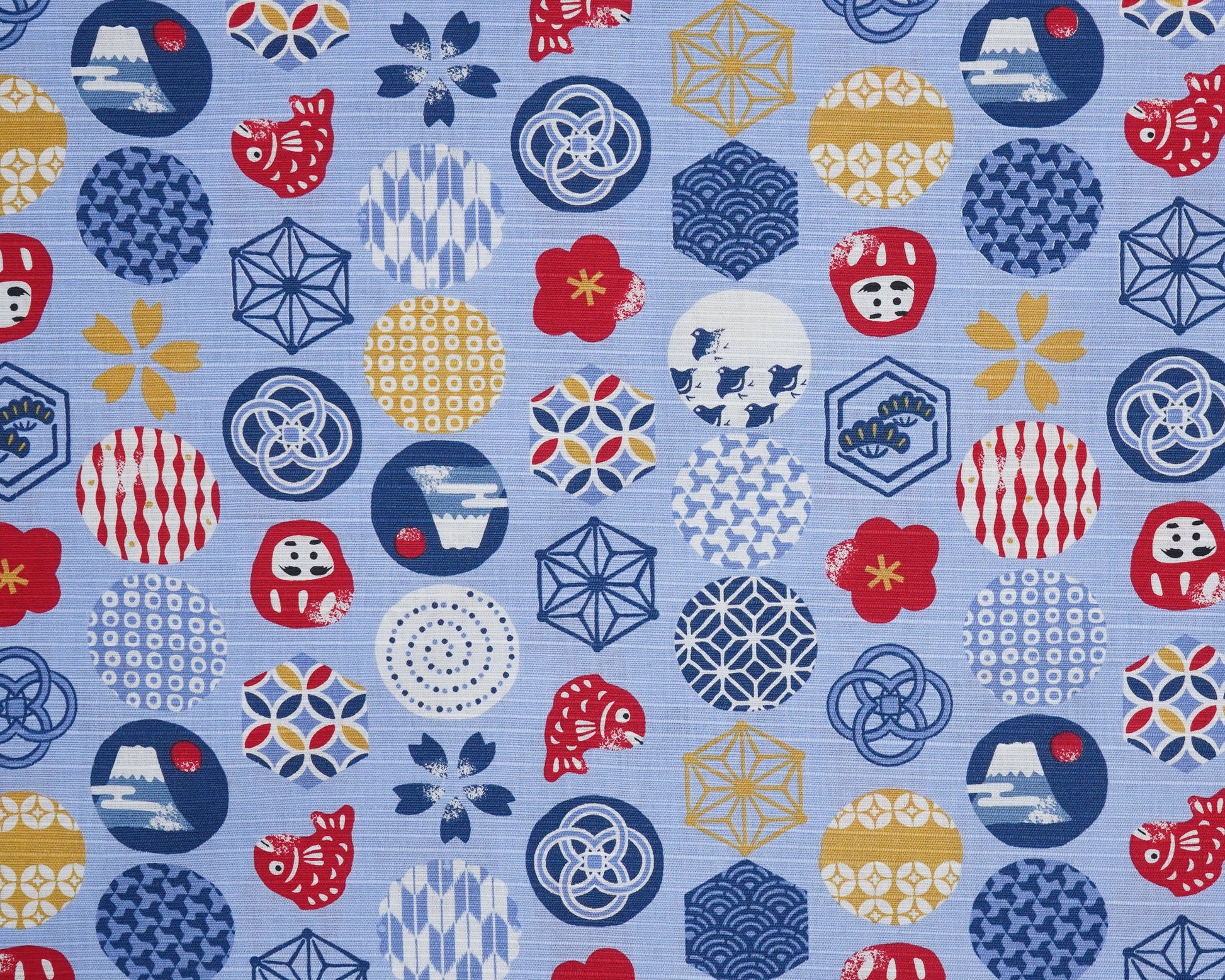 Patterned fabric with geometric shapes and symbols on a blue background