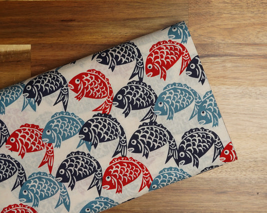 Tai Fish Block Print Look cotton fabric, folded on the bolt