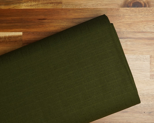 Dobby Solid fabric in Forest Green, folded on the bolt