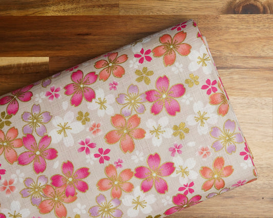 Large-Scale Sakura Flowers on Cream dobby fabric, folded on the bolt