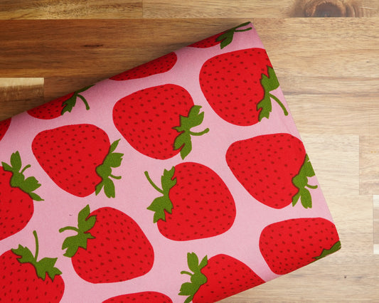 Large Strawberries on Pink cotton oxford, folded on the bolt