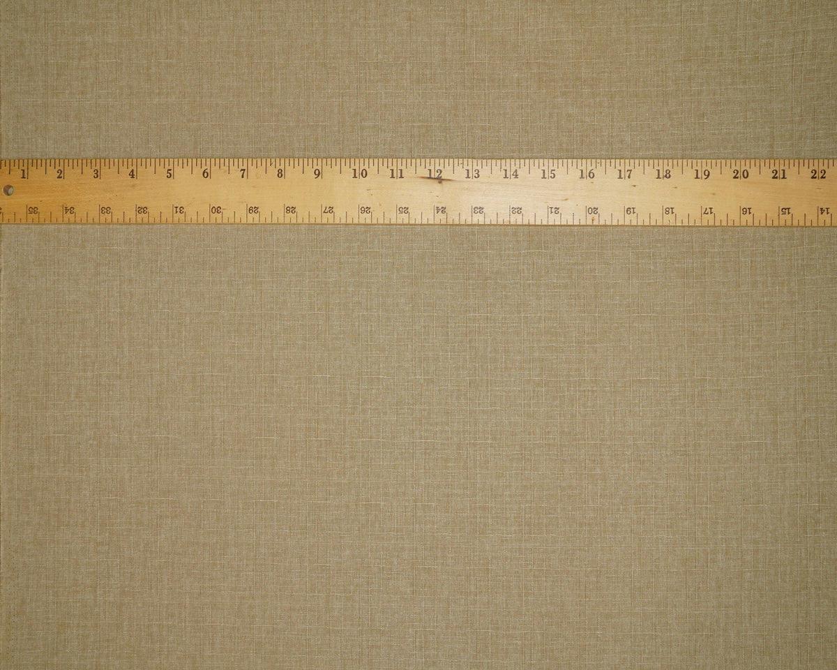 Heathered Solid Dobby fabric in Taupe, laid flat with a ruler for scale