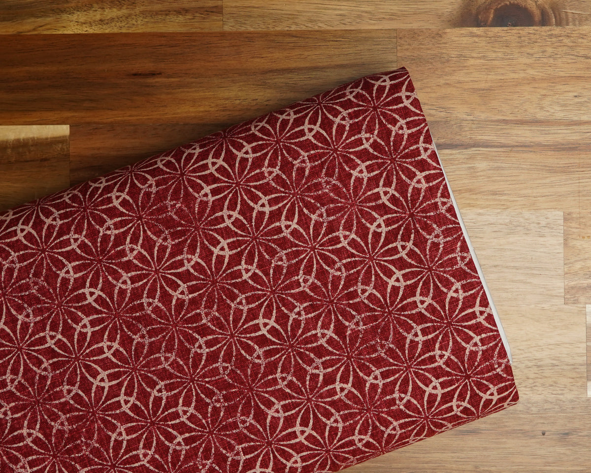Shippou Circles Print on Red dobby fabric, folded on the bolt