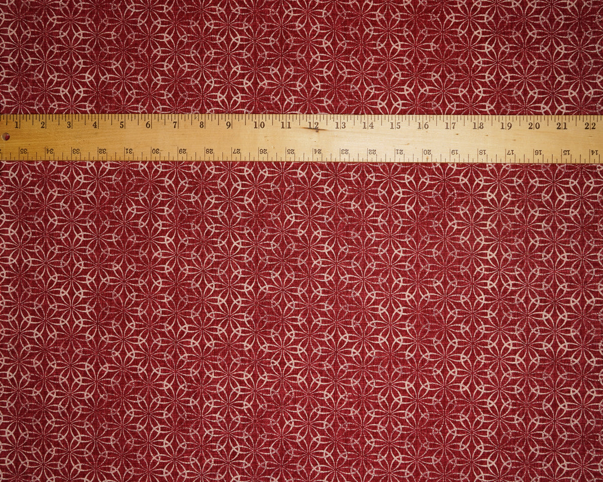 Shippou Circles Print on Red dobby fabric, laid flat with a ruler for scale