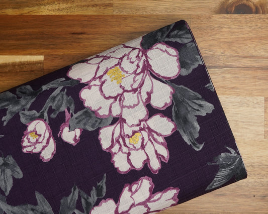 Oversized Peony Floral on Purple dobby fabric, folded on the bolt