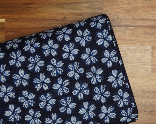 Faux Shibori Sakura on Indigo cotton fabric, folded on the bolt