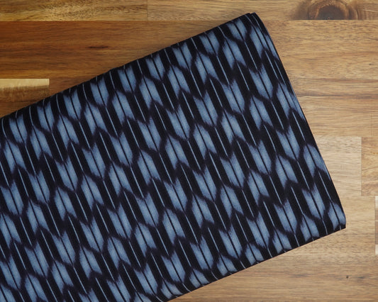 Faux Shibori Ikat Yabane Arrows on Indigo cotton fabric, folded on the bolt
