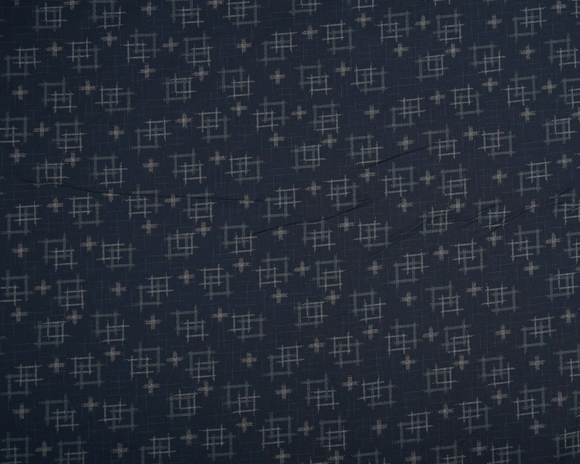 Navy blue fabric with small geometric pattern