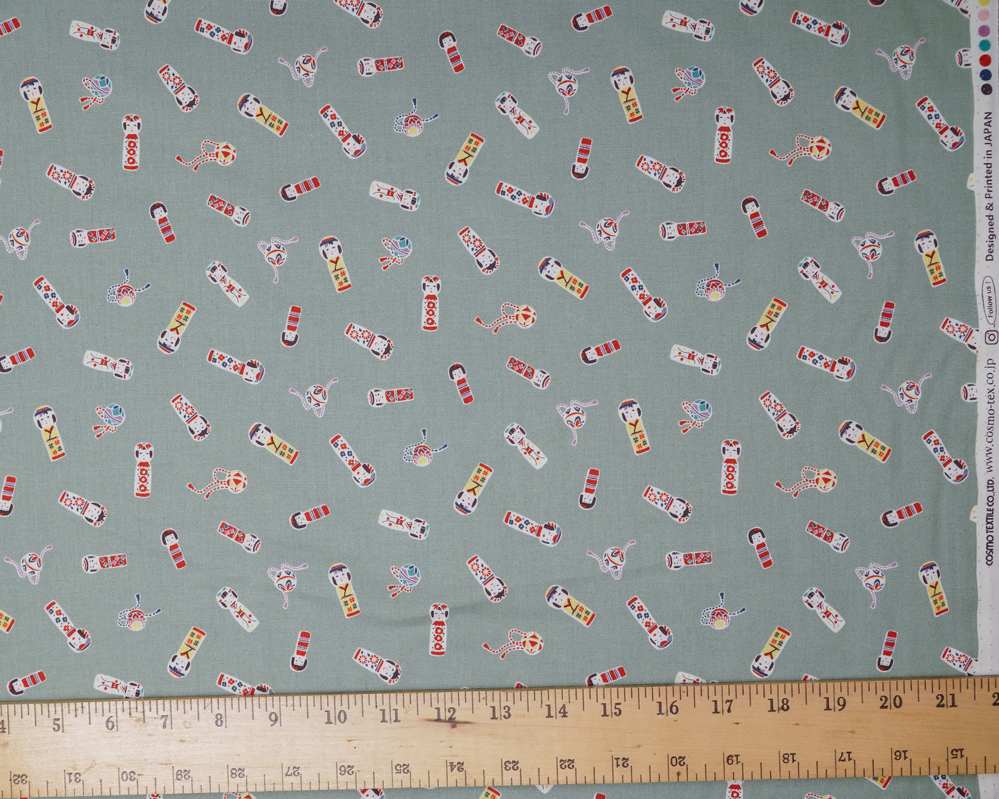 Kokeshi Doll Scatter on Sage Green - Cotton Fabric - Cosmo