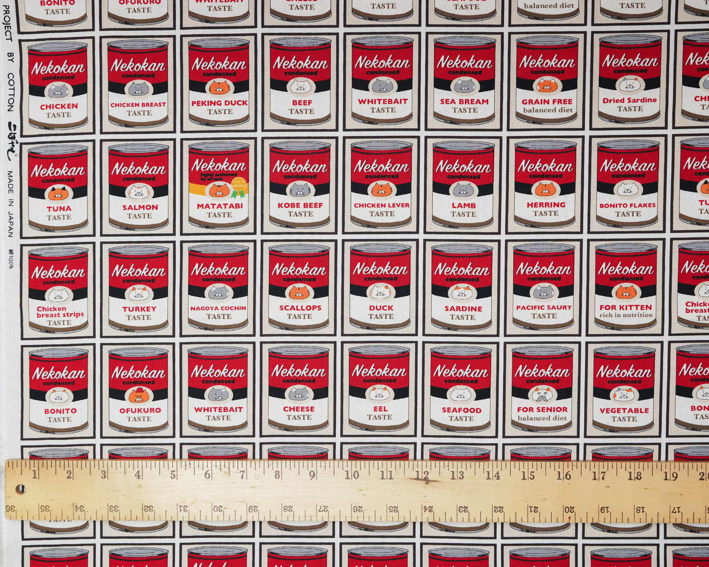 Pattern of Nekokan pet food cans with a ruler at the bottom for scale.