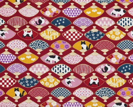 Patterned fabric with colorful traditional designs on a red background