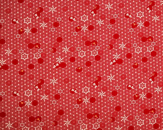 Red patterned fabric with geometric shapes on a red background