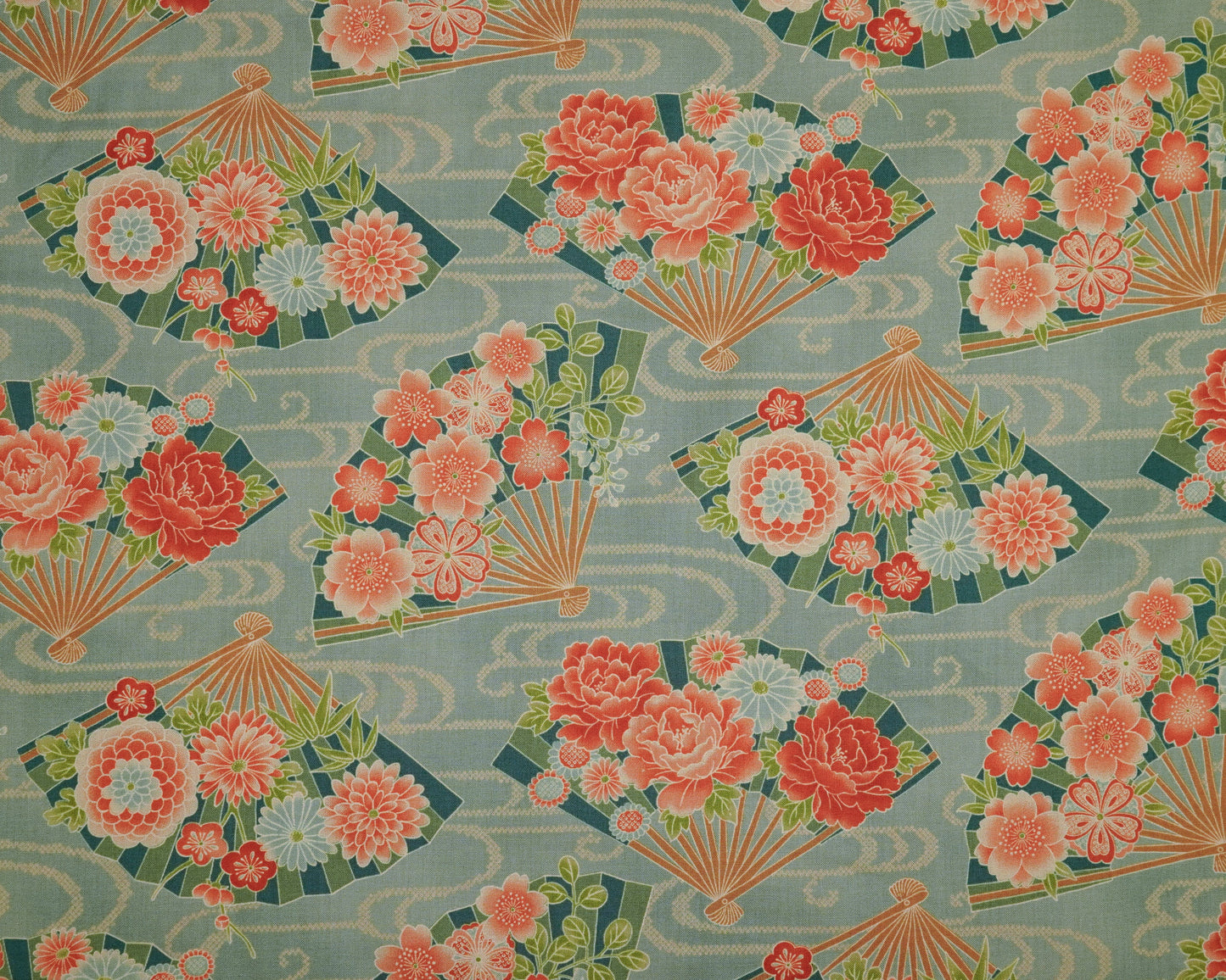 Patterned fabric with fans and flowers on a teal background