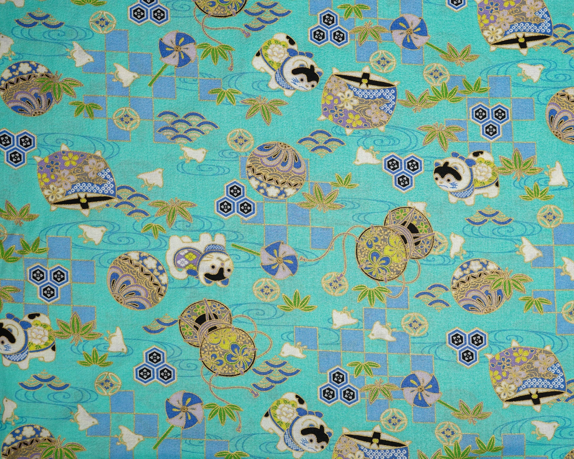 Decorative fabric with a pattern of cartoon characters and geometric shapes on a blue background