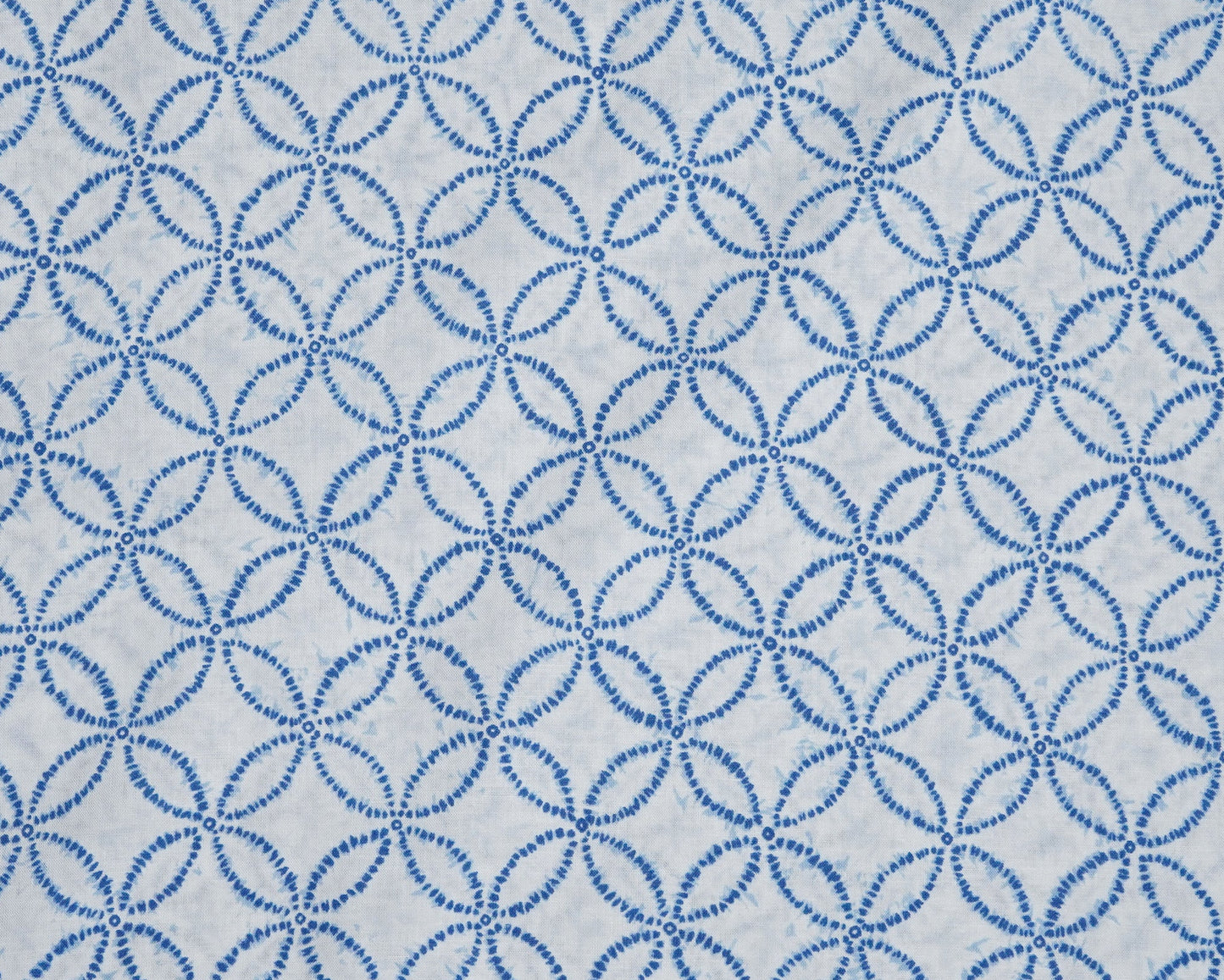 Blue circular pattern on a white background
