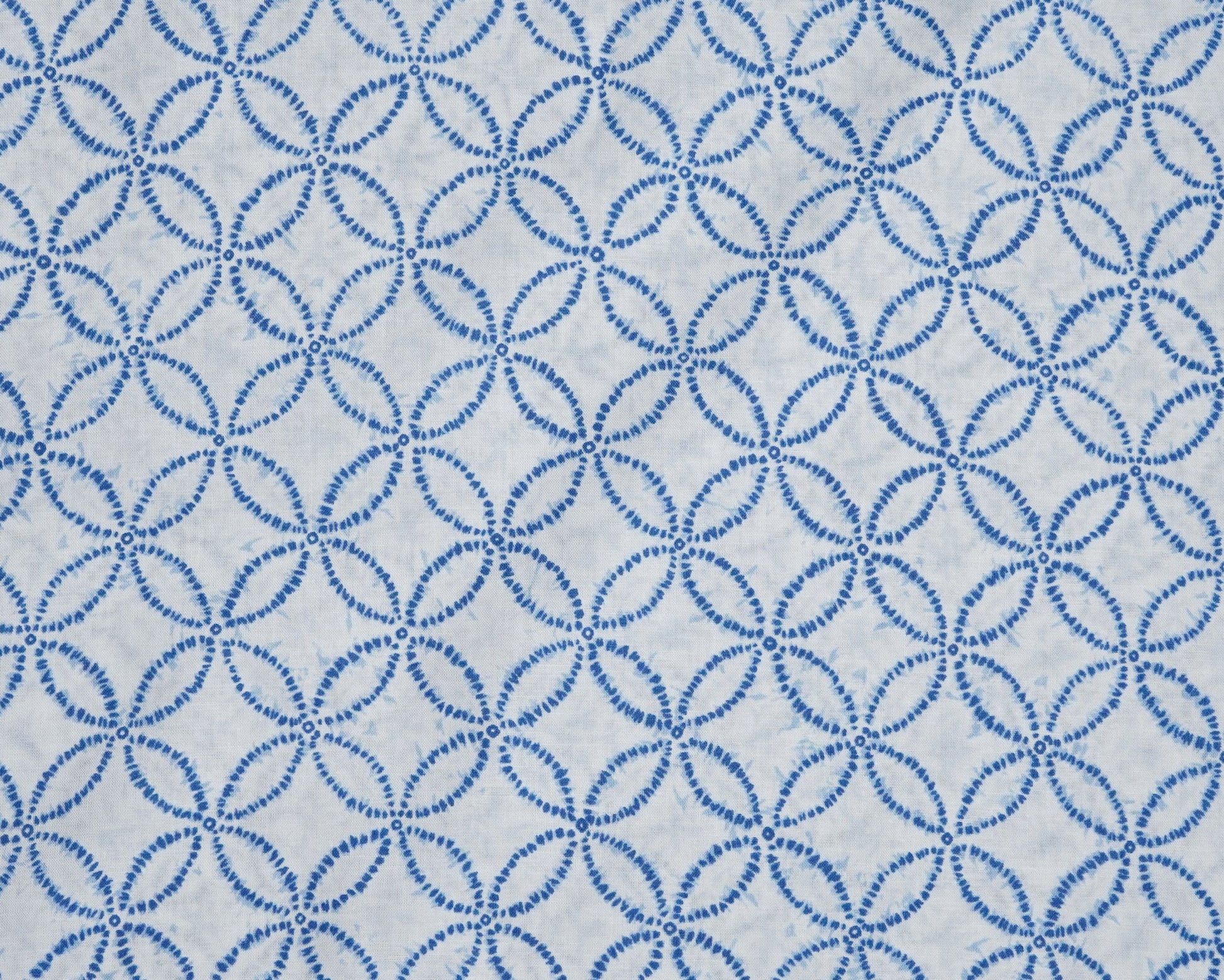 Blue circular pattern on a white background